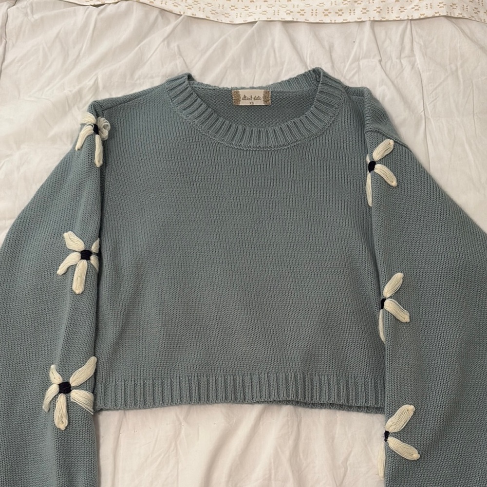 Blue Sweater with Floral Accents